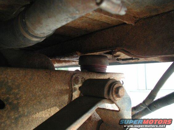 The two rear cab mounts with the Super Duty rubbers in place; with full weight on them, they compressed to 1 15/16". I had to trim the bottom shoulder down to just over 1 1/2".