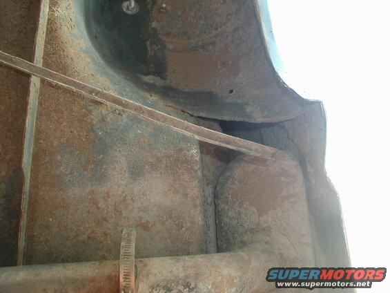 Left side, looking straight up (shackle to the left).