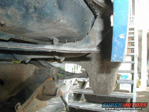 Left side, looking rearward from the wheel well.
