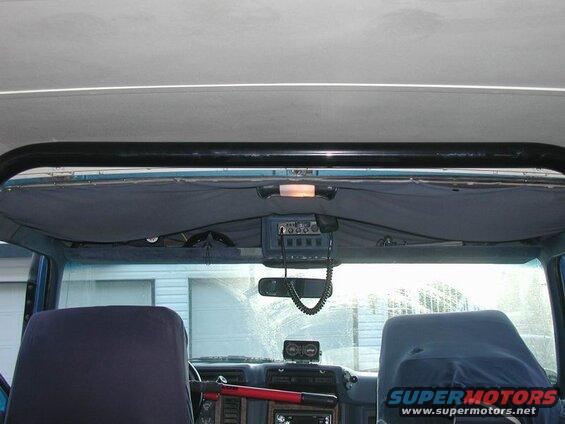 Dry fit in the truck - snug against the topper, so the carpet WILL need to be cut away.