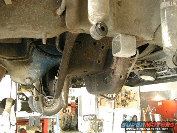 The crossmember has to be trimmed to clear the straight axle.