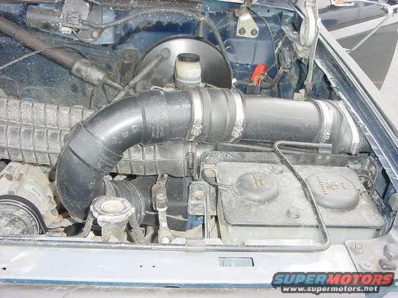 Ford Bronco engine bay with intake tube and coolant reservoir