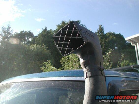 Black snorkel with grid head on a blue vehicle.