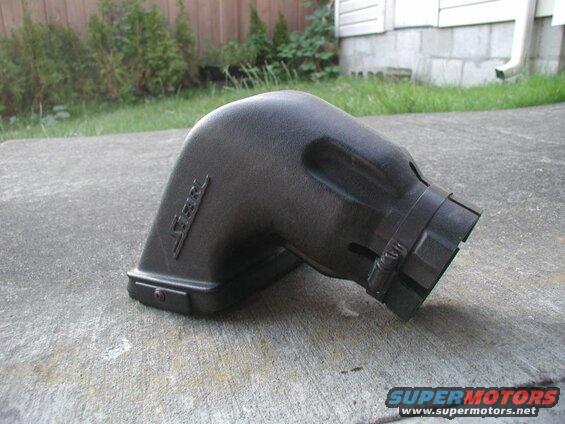 Black K&N intake tube on concrete