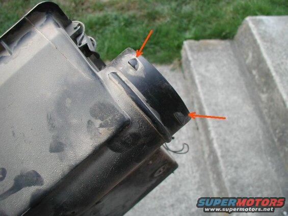 First I removed the airbox. Then I ground off the three short tabs that the factory hose "locked" onto.
