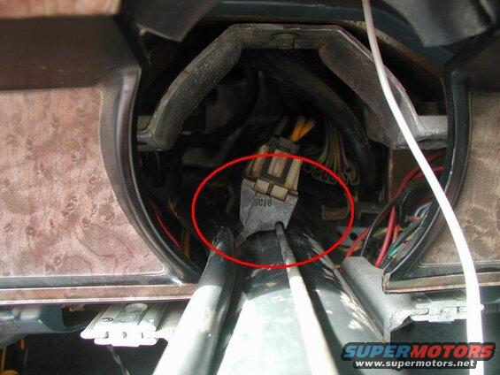 Lower the steering column and remove the two (11mm) bolts holding the ignition switch to the steering column. Separate the ignition rod from the ignition switch and pull some slack for the wiring harness running up the column. Raise the column and bolt it back to the dash.