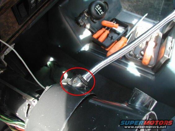 Drive out the roll pin and remove the shift lever and rubber boot. Unscrew and remove the turn signal lever.