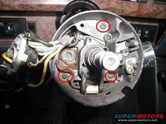 Undo the three screws and slide off the upper cover.