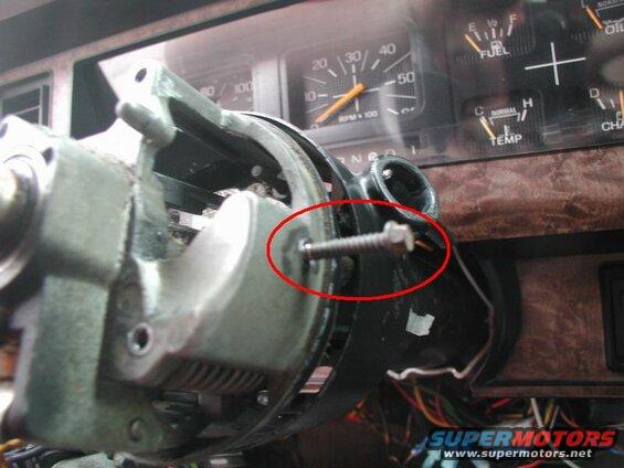 Thread a screw into the pin; when the pin starts to rotate, lightly pull it out.