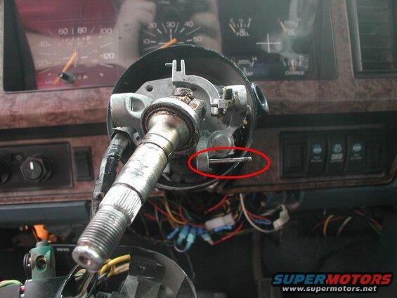 I thought I needed to drive out this lock pin that the tilt jaw (see next picture) locks onto, but it turns out that you can press upwards on the tilt jaw and pull outwards to clear the pin.