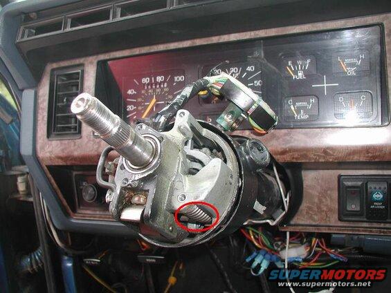 Carefully put the tilt spring in.