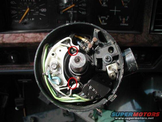 Slide the signal switch on and tighten the two screws.