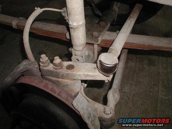 Vehicle suspension and brake components including rotor, shock, leaf springs, and tie rod.