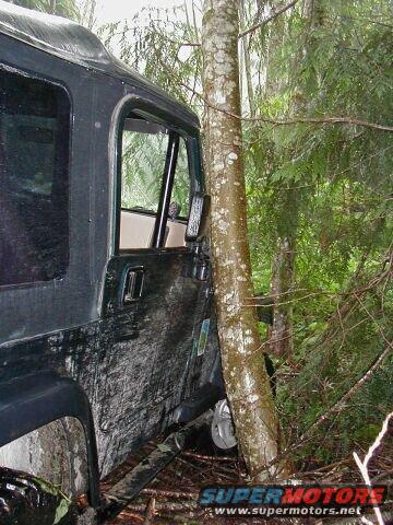 John slid off to the right while crossing the fallen tree. He had about 1/4" of clearance at this point.