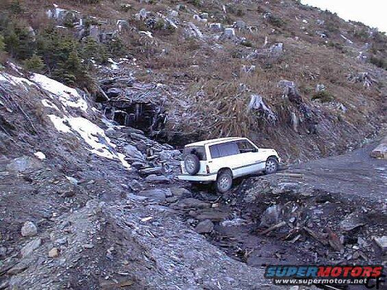 Chris F crossing a tricky washout.