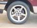 1997 Ford F-150 - Close-up of a chrome wheel and tire, with brake components visible.