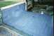 1978 Ford Bronco - Vehicle interior being restored, with protective coating applied to the bed and floor.
