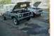 1978 Ford Bronco - Two trucks, a 1978 Ford Bronco and a Ford F-Series, are parked outside with their hoods open, connected by jumper cables.