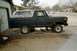 1978 Ford Bronco - This 1978 Ford Bronco is undergoing maintenance, parked beside a garage with tools visible.