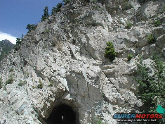 Tunnel entrance in a rocky mountainside