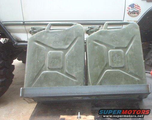 cans3.jpeg they sit snugly in this holder i made out of 2x2x 1/4" thick angle.....