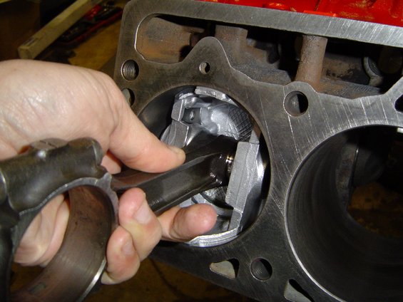 engine-reassembly-034.jpg Using the piston to put the ring into the bore straight to measure end gap