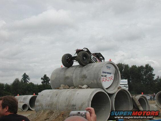 Remote-controlled rock crawler on concrete pipes.
