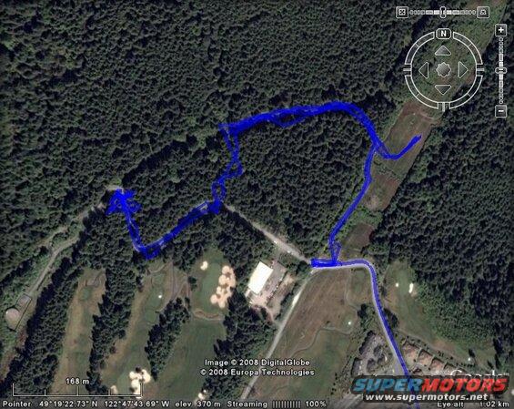 Satellite image showing a blue GPS track over a forest and golf course.