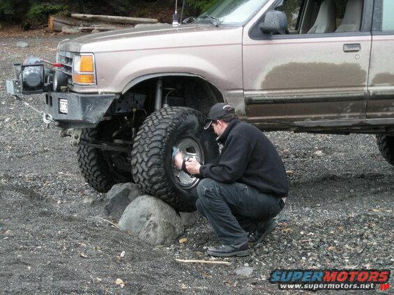 Mike polishing part of Indir's wheel.