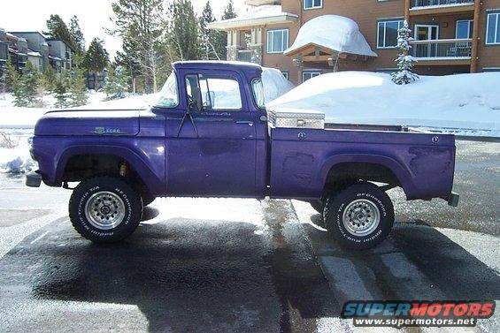 Side view of a purple 1959 Ford F-100 pickup truck with a toolbox in the bed