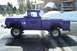 1959 Ford F-100 - This purple 1959 Ford F-100 pickup truck is seen in a snowy environment, possibly a ski resort town.