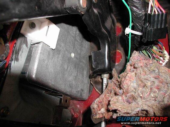 Interior of a 1990 Ford F-250 showing brake pedal, wiring, and insulation.