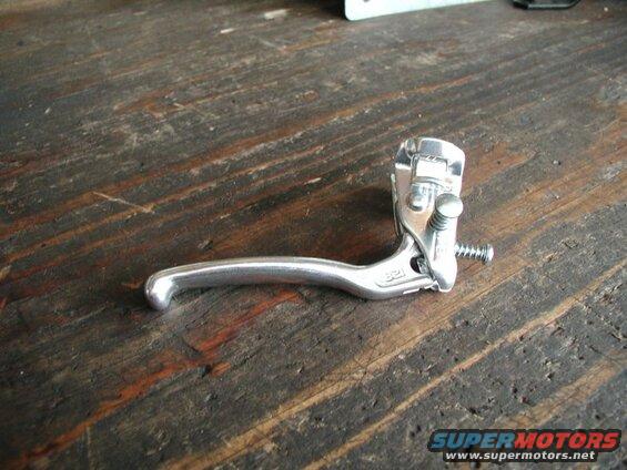 Silver bicycle brake lever on a wooden table