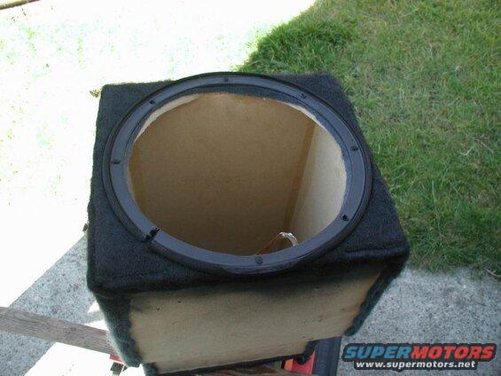 Subwoofer box with open top and black trim ring
