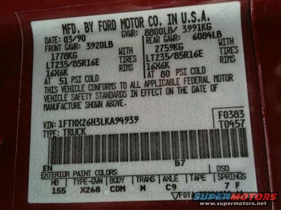 Close-up of a Ford Motor Company data plate with vehicle information.