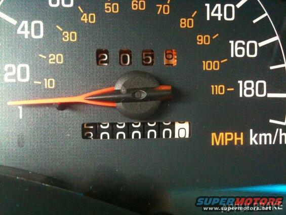 Car odometer reads 205600 and speedometer needle is near 0.