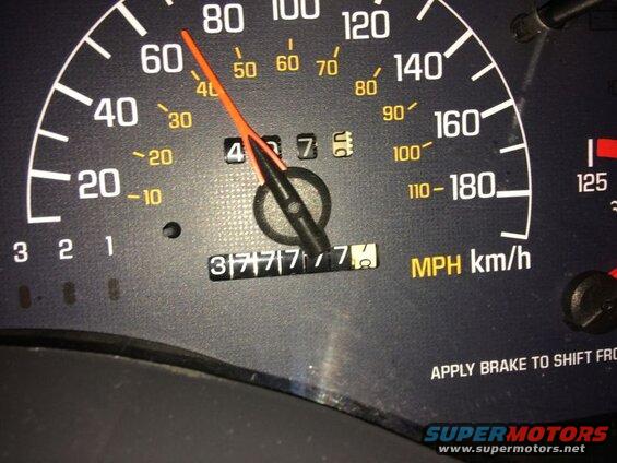 Vehicle dashboard showing odometer reading 37777.7 and speedometer at 40+ MPH.