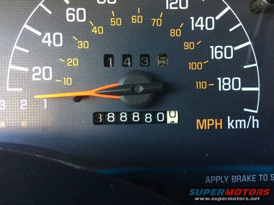 Car dashboard with speedometer showing 10 MPH and odometer reading 38880.