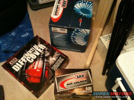 Three ARB product boxes: differential cover, air locker, and air compressor.