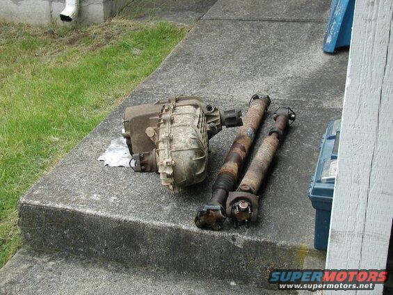 Transfer case and two driveshafts on concrete steps