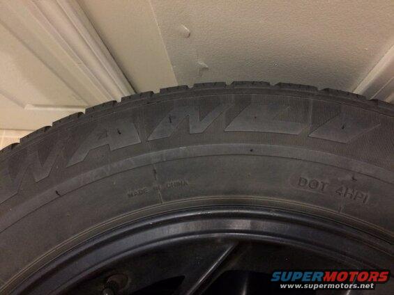 Close-up of a WANDA tire with "MADE IN CHINA" and "DOT 4HPI" text.