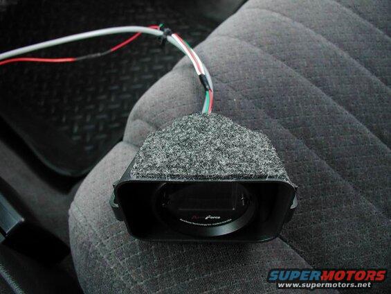 I was concerned about light coming from the dash cluster and shining in behind the gauge, so I stuck a piece of trunk liner to the top of the cubby.