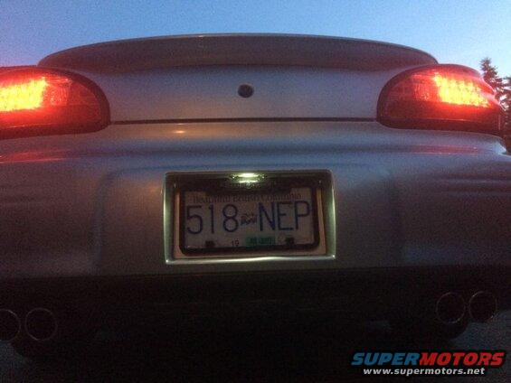 Dusk shot, license light on. The frame blocks the license light.