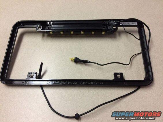 Black license plate frame with LED lights and wiring