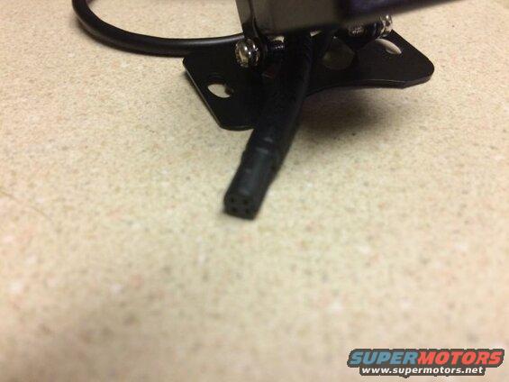 Black camera connector with pins and mounting bracket