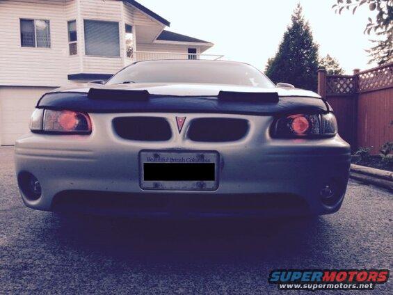 Silver 2002 Pontiac Grand Prix front view with car bra