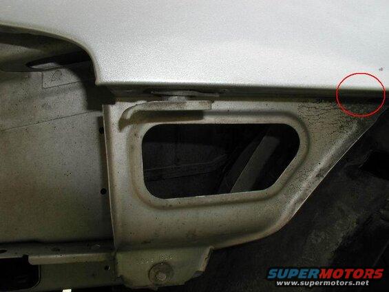This is where the "hidden" 10mm bolt goes into the fender.