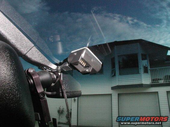 The base mounted up behind the right side of the rear view mirror.