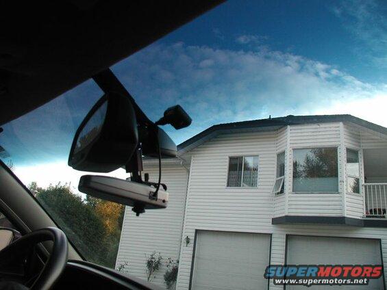 The base mounted up behind the right side of the rear view mirror.