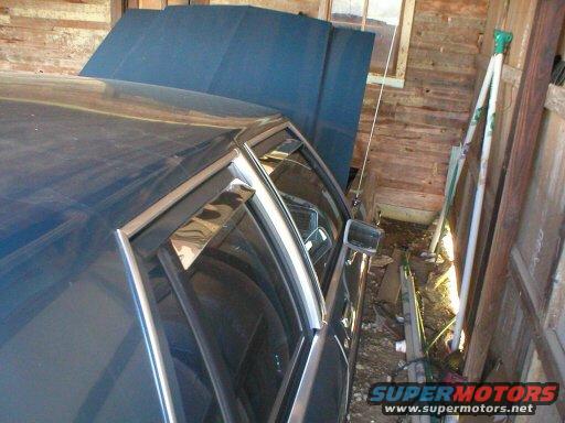 1987 Ford Crown Victoria LTD with hood open in a wooden garage